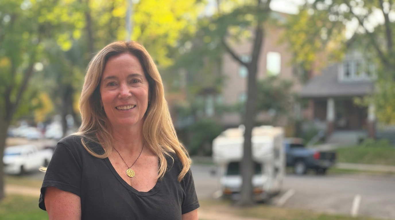 Kara, certified life coach and founder of Winged Roots Coaching, outdoors in her neighborhood